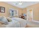 This bedroom has carpet floors, a large window with a view and a ceiling fan at 884 Loma Bonita Pl, Las Vegas, NV 89138