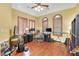 Spacious bedroom featuring hardwood floors, shutters, and desk area at 884 Loma Bonita Pl, Las Vegas, NV 89138