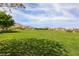 Vast community field with lush grass and mountain views, ideal for outdoor activities and recreation at 884 Loma Bonita Pl, Las Vegas, NV 89138
