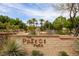 Beautiful community sign with lush trees and professionally installed landscaping at the Paseos Park community at 884 Loma Bonita Pl, Las Vegas, NV 89138