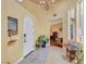 Inviting foyer with tile floors, a white front door, and neutral paint at 884 Loma Bonita Pl, Las Vegas, NV 89138