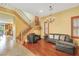 Charming foyer featuring stairs, a chandelier, and access to the kitchen area at 884 Loma Bonita Pl, Las Vegas, NV 89138