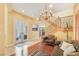 Grand foyer with staircase, chandelier, and view to the outdoor seating area at 884 Loma Bonita Pl, Las Vegas, NV 89138
