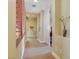 Neutral hallway with wood shutters, wall niches, plush carpeting and white trim at 884 Loma Bonita Pl, Las Vegas, NV 89138