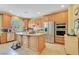 Spacious kitchen with stainless steel appliances, granite countertops, and a center island at 884 Loma Bonita Pl, Las Vegas, NV 89138