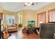 Comfortable office with wood floors, a tray ceiling, and natural light at 884 Loma Bonita Pl, Las Vegas, NV 89138
