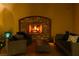 Inviting patio with stone fireplace, outdoor furniture, and warm lighting at 884 Loma Bonita Pl, Las Vegas, NV 89138