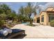 Sprawling backyard with inviting pool and lounge chair under a shady tree at 9 Chalet Hills Ter, Henderson, NV 89052