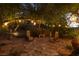 Charming outdoor patio area with string lights and comfortable seating, ideal for relaxing and entertaining at 9 Chalet Hills Ter, Henderson, NV 89052