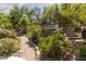 Serene backyard featuring multiple seating areas, lush landscaping, and a peaceful ambiance for outdoor enjoyment at 9 Chalet Hills Ter, Henderson, NV 89052