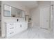 Elegant bathroom with marble floors and a vanity with storage at 9 Chalet Hills Ter, Henderson, NV 89052