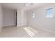 Bright bedroom features wood-look floors and white shutters on two windows at 9 Chalet Hills Ter, Henderson, NV 89052