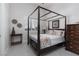 Cozy bedroom featuring a four-poster bed and natural light at 9 Chalet Hills Ter, Henderson, NV 89052