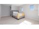 Bright bedroom featuring light wood floors and two windows with lovely shutters at 9 Chalet Hills Ter, Henderson, NV 89052