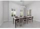 Elegant dining room with modern chandelier and ample seating at 9 Chalet Hills Ter, Henderson, NV 89052