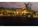 Stunning two-story home with well-lit driveway and manicured landscaping at 9 Chalet Hills Ter, Henderson, NV 89052