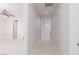 Bright hallway featuring light wood floors leading to an open bedroom at 9 Chalet Hills Ter, Henderson, NV 89052