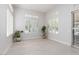 Bright living room featuring plantation shutters, light wood floors and neutral paint at 9 Chalet Hills Ter, Henderson, NV 89052