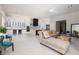 Bright living space with a white kitchen, modern furnishings, and lots of space for entertaining guests at 9 Chalet Hills Ter, Henderson, NV 89052