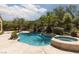 Beautiful pool with spa, rock waterfall and mature landscaping at 9 Chalet Hills Ter, Henderson, NV 89052