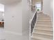 Staircase featuring a modern black and white handrail at 9 Chalet Hills Ter, Henderson, NV 89052