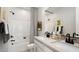 Modern bathroom featuring double sinks, sleek black fixtures, and stylish decor for a luxurious feel at 96 Via Franello, Henderson, NV 89011