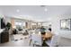 Open living space featuring a dining area, living area, and partial view of the kitchen at 96 Via Franello, Henderson, NV 89011