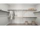 Spacious walk-in closet with ample shelving, hanging rods, and stylish storage solutions for organized living at 96 Via Franello, Henderson, NV 89011