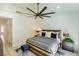 Bright bedroom with ceiling fan, wooden bed frame, and stylish decor offers a peaceful retreat at 9813 Folsom Dr, Las Vegas, NV 89134