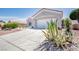 Front exterior of a single-story home with a red tile roof and mature landscaping at 9813 Folsom Dr, Las Vegas, NV 89134