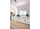 Bright, modern kitchen with white cabinets, light countertops, and stainless steel appliances at 9813 Folsom Dr, Las Vegas, NV 89134