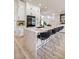 Modern kitchen with a large island, white cabinets, and stainless steel appliances at 9813 Folsom Dr, Las Vegas, NV 89134