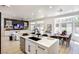 Open-concept living room and dining area with modern furnishings and ample natural light at 9813 Folsom Dr, Las Vegas, NV 89134