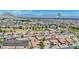 Aerial photo showcases neighborhood with mountain backdrop, golf course proximity, and nearby amenities at 9813 Folsom Dr, Las Vegas, NV 89134