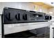 Close-up of a black gas range with digital display and stainless steel accents at 9813 Folsom Dr, Las Vegas, NV 89134