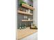 Stylish shelving with wood countertop, white cabinets, floating shelves, and decorative artwork at 9813 Folsom Dr, Las Vegas, NV 89134