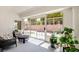 Bright sunroom with cozy seating, large windows, and views of the backyard, perfect for relaxing and enjoying the natural light at 9813 Folsom Dr, Las Vegas, NV 89134