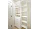 Customizable white shelving and drawers in a walk-in closet provide ample storage solutions at 9813 Folsom Dr, Las Vegas, NV 89134