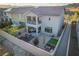Aerial view of a private backyard, showcasing a patio, garden, and charming string lights at 10031 Fletcher Peak Ave, Las Vegas, NV 89178