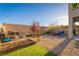 Backyard with BBQ, seating, landscaping, and gravel groundcover at 10031 Fletcher Peak Ave, Las Vegas, NV 89178