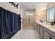 Beautiful bathroom featuring a glass enclosed shower with a rain shower head and a double vanity at 10031 Fletcher Peak Ave, Las Vegas, NV 89178