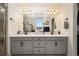 Bright bathroom features a double vanity, modern fixtures and great storage space at 10031 Fletcher Peak Ave, Las Vegas, NV 89178