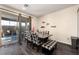 Cozy dining area features gray wood floors, sliding door to patio, and modern decor at 10031 Fletcher Peak Ave, Las Vegas, NV 89178