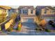 Charming two-story home features a well-manicured lawn, paved driveway, and attached two-car garage at 10031 Fletcher Peak Ave, Las Vegas, NV 89178