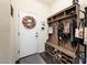 Mud room features coat rack, shoe storage, and a decorated front door at 10031 Fletcher Peak Ave, Las Vegas, NV 89178