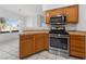 Well-lit kitchen with stainless steel appliances and tile countertops, perfect for cooking at 10116 Jacob Pl # 104, Las Vegas, NV 89144