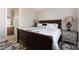 Comfortable bedroom with a queen bed, stylish lamps, and a patterned rug at 10370 Sweet Laurel St, Las Vegas, NV 89178