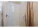 Clean and modern walk-in shower with white subway tile and a glass door at 10370 Sweet Laurel St, Las Vegas, NV 89178