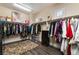Large walk-in closet with ample storage and an area rug at 10370 Sweet Laurel St, Las Vegas, NV 89178