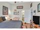 This spacious bedroom with wood floors connects to a bathroom, offering plenty of space and natural light at 1658 Autumn Rust Dr, Las Vegas, NV 89119